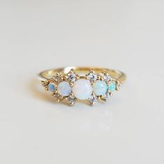 an opal and diamond three stone ring