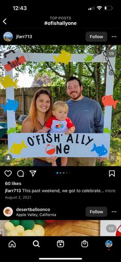 a man and woman holding a baby in front of a sign that says offish ally one