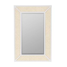 a white and gold framed mirror on a white wall with an intricate border around it