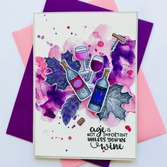 a card with some wine bottles and leaves on it