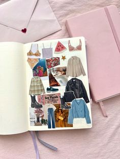 an open book with pictures of clothes and clothing on it, next to a pink envelope