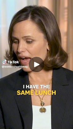 a woman in a suit is talking to someone on the tv show i have the same lunch