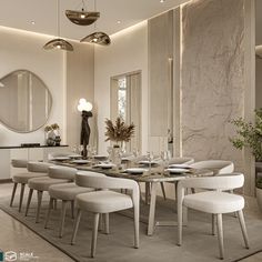 an elegant dining room with white chairs and marble table set for eight, along with round mirrors on the wall