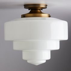 a white light hanging from a ceiling fixture