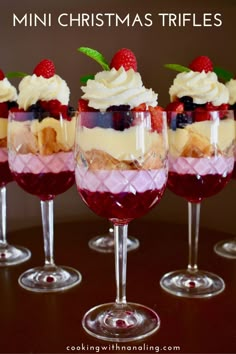 mini christmas trifles in wine glasses on a table