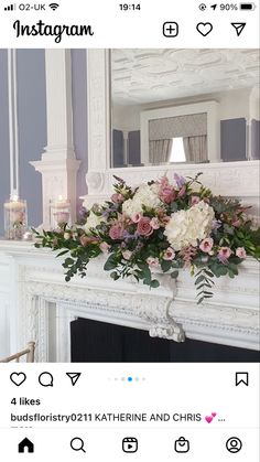 a white fireplace with flowers and candles on it in front of a mirror that says instagram