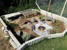 an outdoor fire pit in the middle of a yard