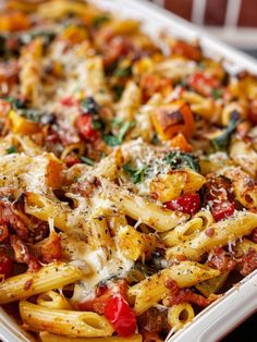 a casserole dish filled with pasta and vegetables