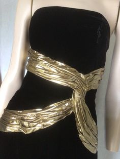 "Vtg 80s A J Bari black and gold Velvet sleeveless Cocktail Dress 8 Preowned. Condition 10/10. No issues to note.  Style A straight form fitting knee length dress,  the bodice is boned for structure and support. Gold lame ribbon swaiths across the bodice give further definition and a unique aspect to this dress. Suitable for any formal, social event, this dress would be a valuable go to in any fashion fashionista wardrobe. Easy to style Fully lined Fastens with a centred rear zip. 7.5\" Front centre kick pleat.  Clipped to the mannequin. Size to fit Australian 10 Go by measurements below garment laid flat Underarm to underarm. 17\". 43cm Waist. 14\". 35.5cm Hips. 18.5\". 47cm Length from underarm. 32\". 81cm Be unique, wear vintage. My photos form an important part of the product descripti Gold Dress Aesthetic, 80’s Dresses, Gold Glitter Dress, Casino Dress, Gold Chic, Clawdeen Wolf, Gold And Black Dress, Golden Dress, Velvet Cocktail Dress