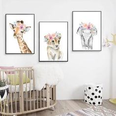 three pictures of giraffes with flowers on their heads are hanging in a child's room