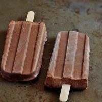 two popsicles sitting next to each other on a table