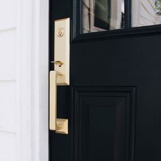 a door handle on a black front door