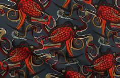 a red and black pattern with gold accents on a gray background, which is very similar to an octopus