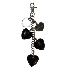 three heart shaped key chains attached to each other