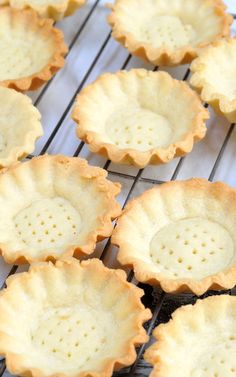 small pie crusts cooling on a wire rack