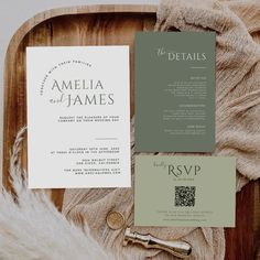 the wedding stationery is laid out on top of a wooden tray with furnishing