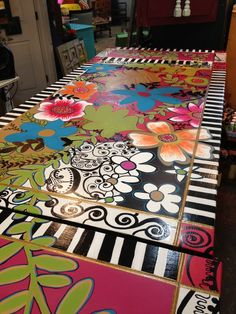 the table is covered with many colorful designs