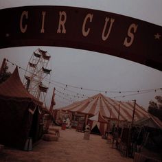 the circus is set up with tents and ferris wheel