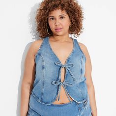 Denim vest from Wild Fable™ tailored in standard fit with a cropped length. Sports an open neck with front-tie fastening featuring bow detailing. Made of midweight cotton for all-day comfortable wear. Classic stitched accents complete the look. If you're not satisfied with any Target Owned Brand item, return it within one year with a receipt for an exchange or a refund. Wild Fable™: A look for every story. Jean Vest Outfits, Sleeveless Blazer Vest, Crop Denim Vest, Denim Tank Top, Denim Tank, Sleeveless Blazer, Nashville Outfits, Pink Vest, Target Clothes