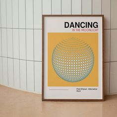 there is a poster on the wall in front of a tile wall that says dancing in the moonlight