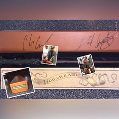 an old baseball bat with autographs on it and some other items in the box