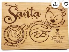 a wooden plaque with santa and other christmas related items