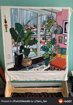 an image of a living room with plants in the window