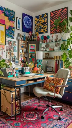 an office with lots of art hanging on the wall and a chair in front of it