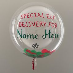 a clear balloon with the words special elf delivery for name here on it