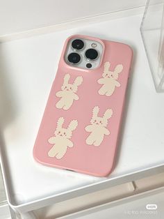 an iphone case with some bunny stickers on it