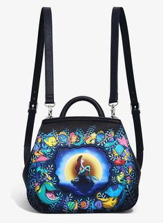 Take Ariel on a tour to explore that shore up above! The Disney Princess can be part of your world when you add this faux leather Loungefly mini backpack to your outfit. A dreamy graphic of Ariel sitting in front of the moon is printed on the exterior, surrounded by her friends from under the sea. This accessory also features an enamel brand badge, silver-tone hardware, blue interior lining with an allover character print from Disney's The Little Mermaid, an interior zippered pocket, and adjusta Loungefly Purse, Mermaid Purse, Mermaid Bag, Loungefly Mini Backpack, Part Of Your World, Disney The Little Mermaid, Mini Backpack Purse, Little Mermaid Ariel, Loungefly Bag