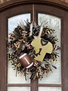 a football wreath is hanging on the front door