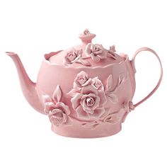 a pink tea pot with flowers on it