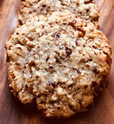 two cookies sitting on top of a wooden table