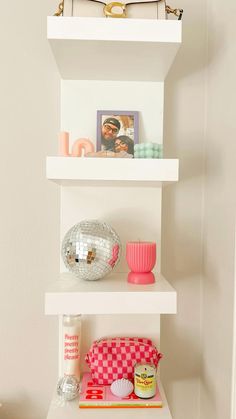 a white shelf filled with different types of items