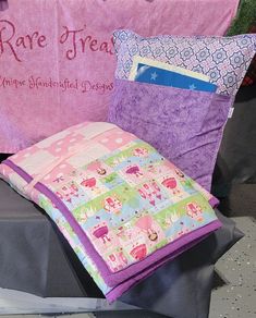 pillows and blankets are on display for sale