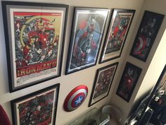 the avengers posters are on the wall in this room