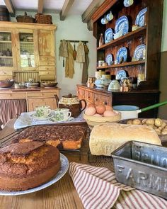 an old fashioned kitchen filled with bread and other foods