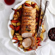 a white plate topped with meat and veggies