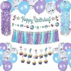 a birthday party with balloons, cupcakes and decorations