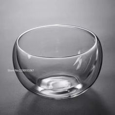 a glass bowl sitting on top of a table