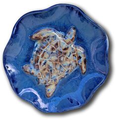 a blue plate with a turtle on it