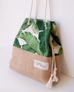 a green and white bag hanging from a wall