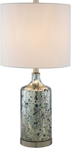 a table lamp with a white shade on the top and blue speckles on the bottom