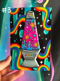 a hand holding up a card with an image of a rocket ship