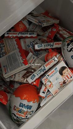 an open refrigerator filled with lots of different types of candy and milk bar wrappers