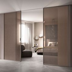 an open sliding glass door in a bedroom