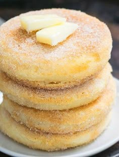 a stack of pancakes with butter on top