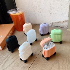 several small toy animals sitting on top of a wooden table