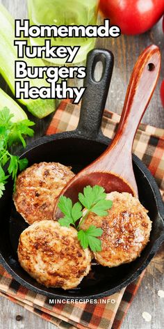 homemade turkey burgers in a cast iron skillet with parsley on the side